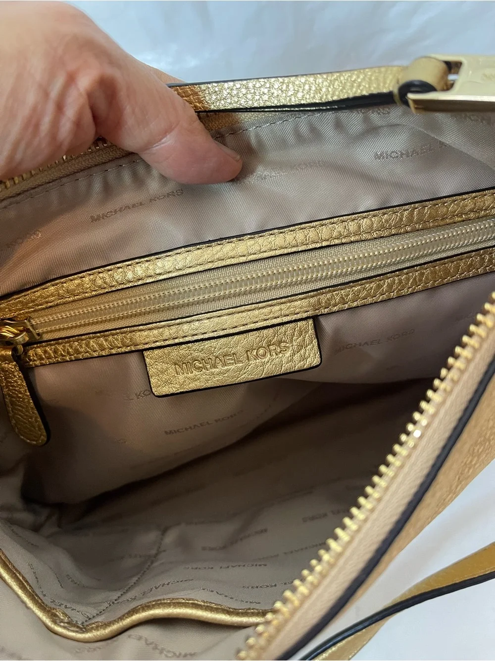 Michael Kors Gold leather hobo crossbody bag.